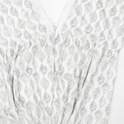 Brand and care label for Cupshe women’s white floral a-line, size S