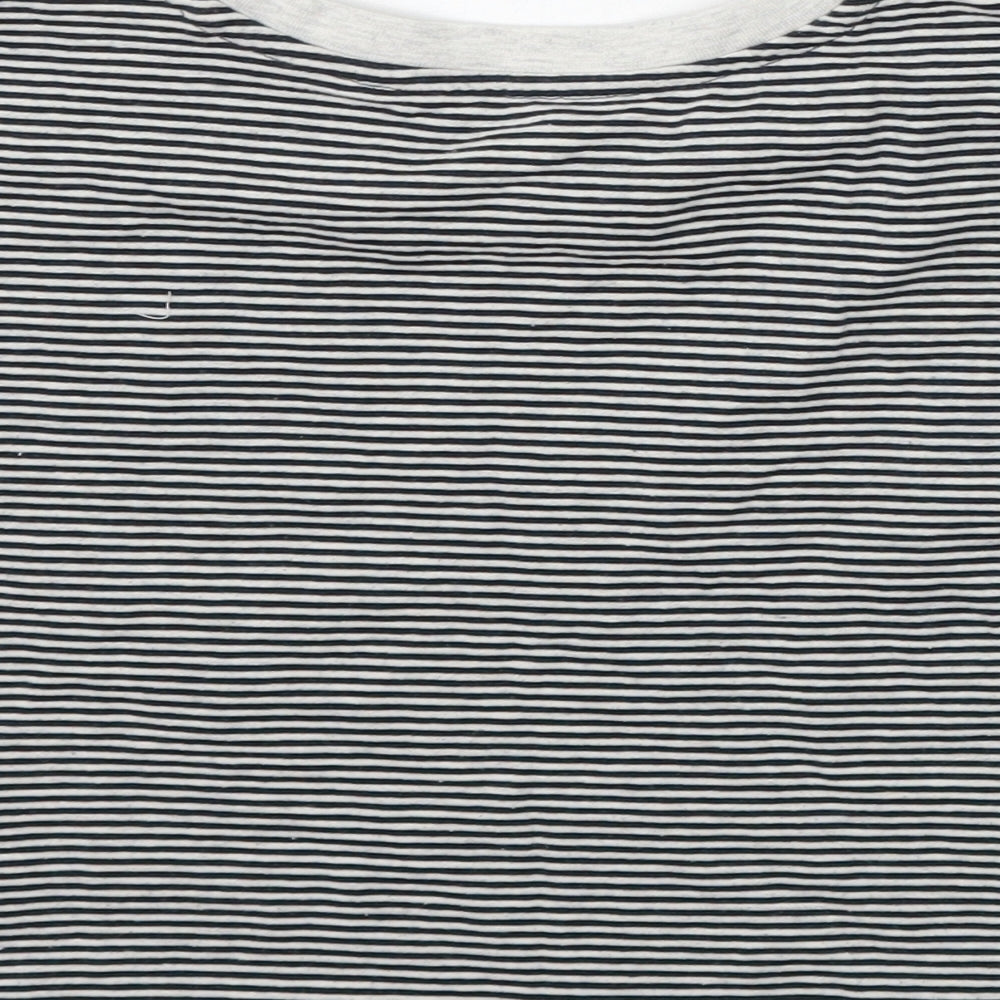 Brand and care label for Tu girls’ black striped basic t-shirt, size 6, years