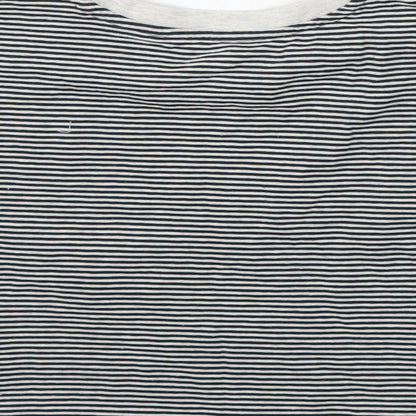 Brand and care label for Tu girls’ black striped basic t-shirt, size 6, years
