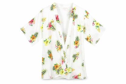 Front view of New Look girls’ white floral kimono jacket, size S