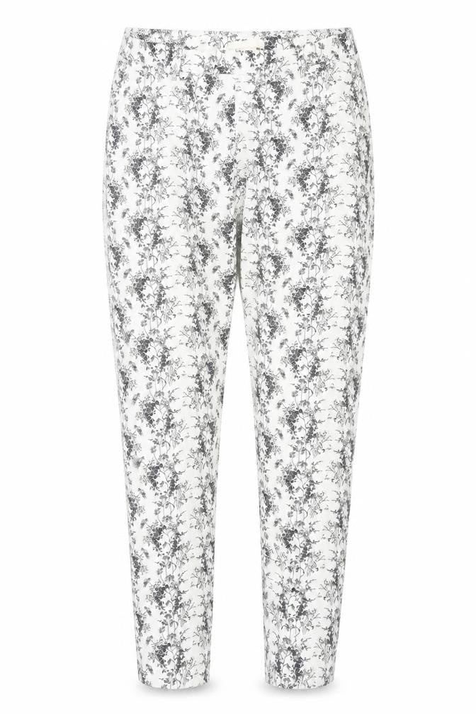 Front view of H&M women’s white floral trousers, size UK 8, 28-inch leg