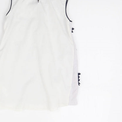Brand and care label for George girls’ white basic tank, size 7, years