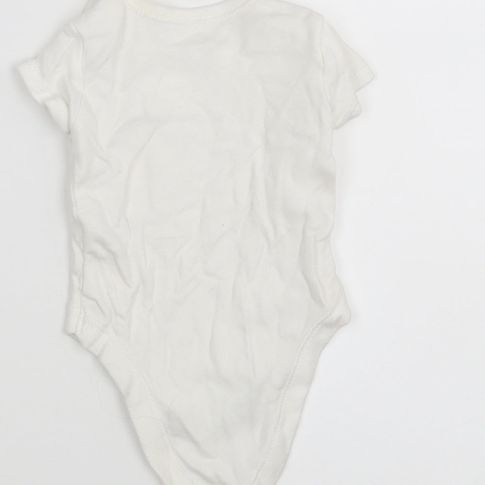 Brand and care label for Matalan boys’ white leotard one-piece size newborn