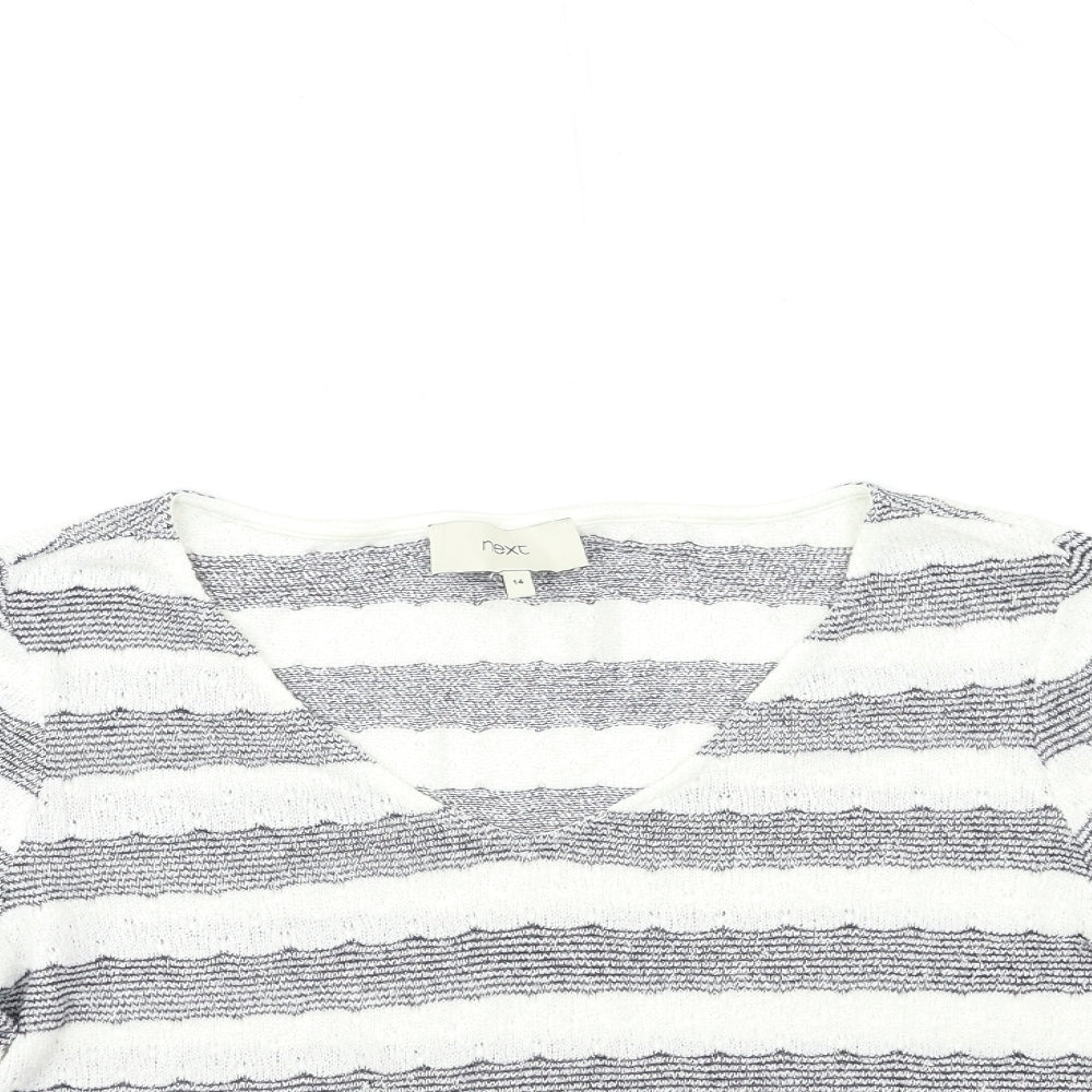 Close-up detail of net women’s white striped knit jumper, size UK 14
