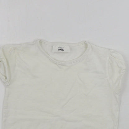 Close-up detail of Next girls’ white basic t-shirt, size 6, years