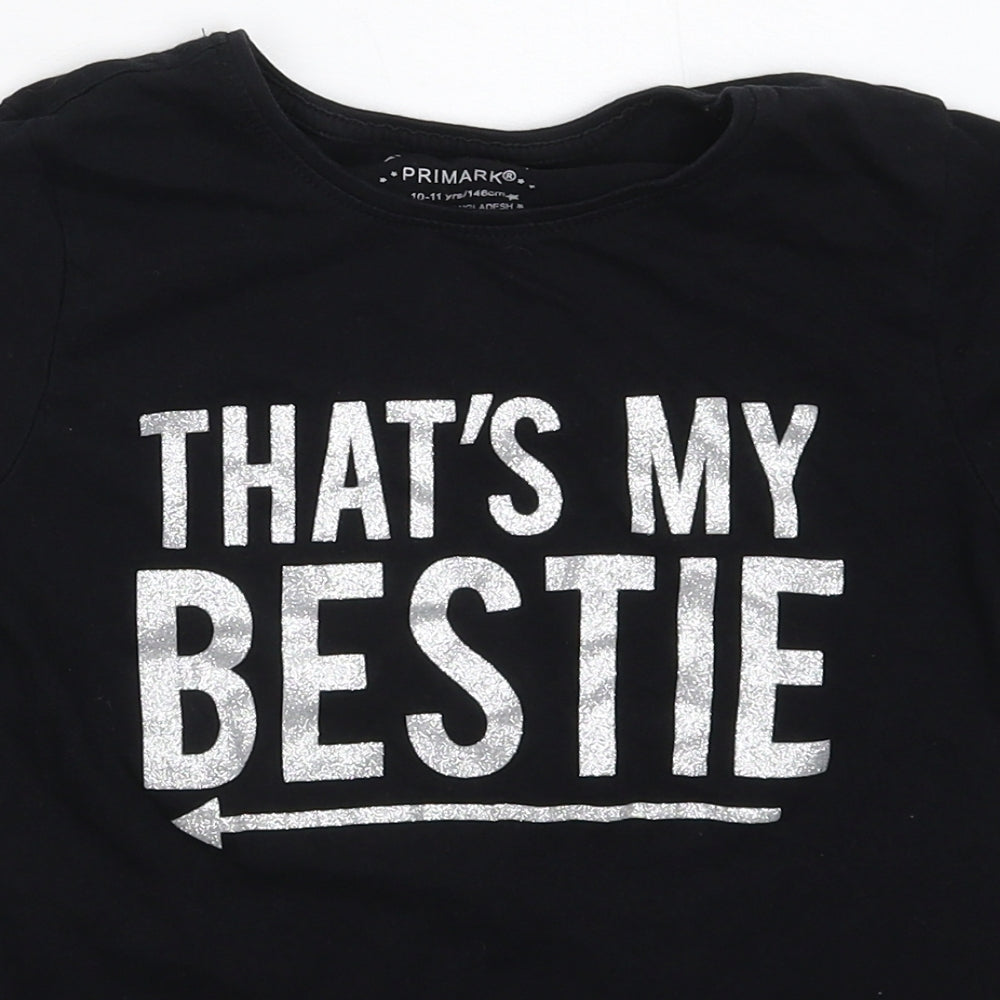 Close-up detail of Primark girls’ black basic t-shirt, size 10-11, years