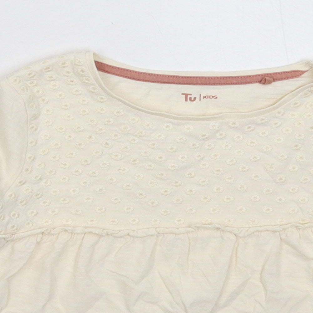 Close-up detail of Tu girls’ beige basic t-shirt, size 6-7, years