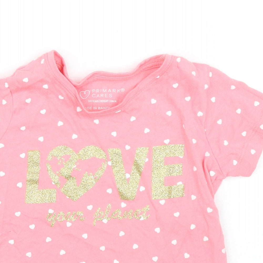 Close-up detail of Primark girls’ pink polka dot basic t-shirt, size 3, years