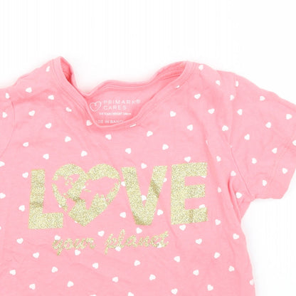 Close-up detail of Primark girls’ pink polka dot basic t-shirt, size 3, years