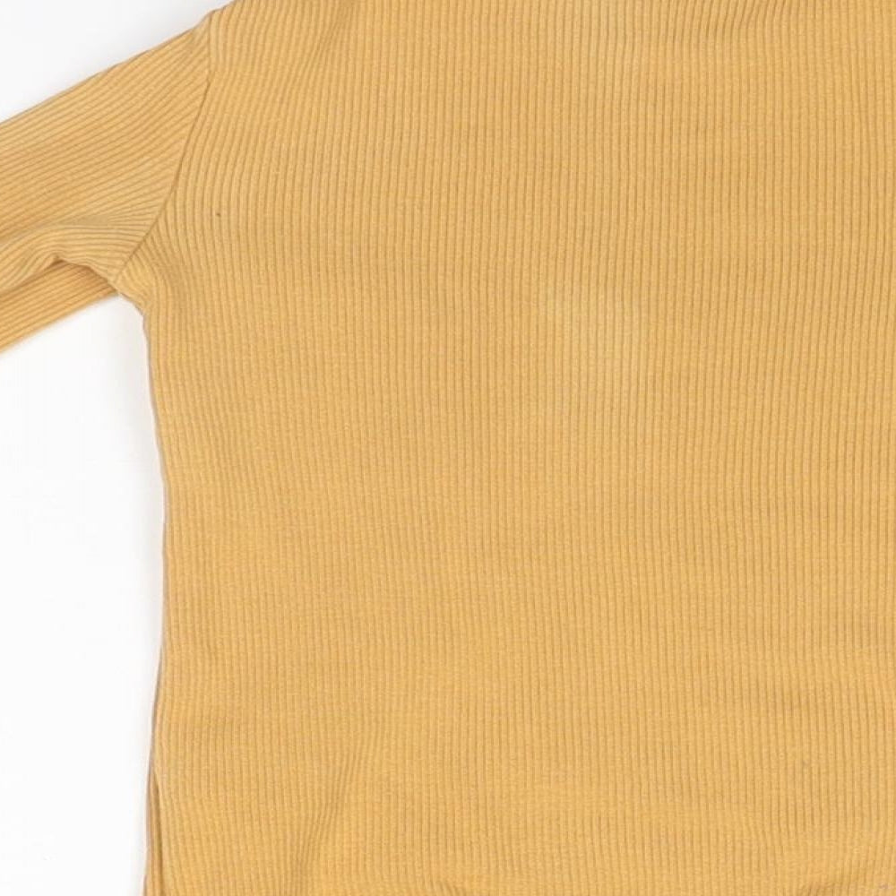 Brand and care label for F&F girls’ orange pullover, size 3-4, years