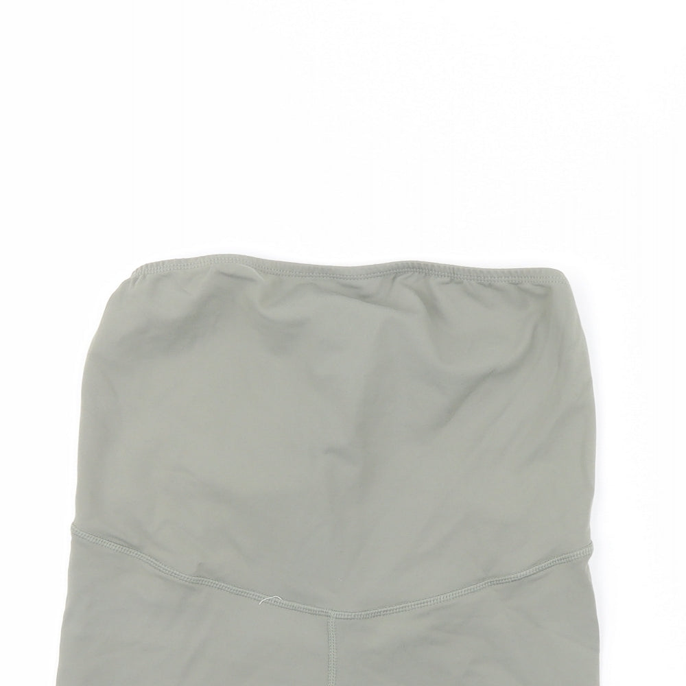 Close-up detail of Body women’s green compression shorts, size S