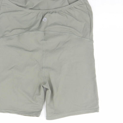 Brand and care label for Body women’s green compression shorts, size S