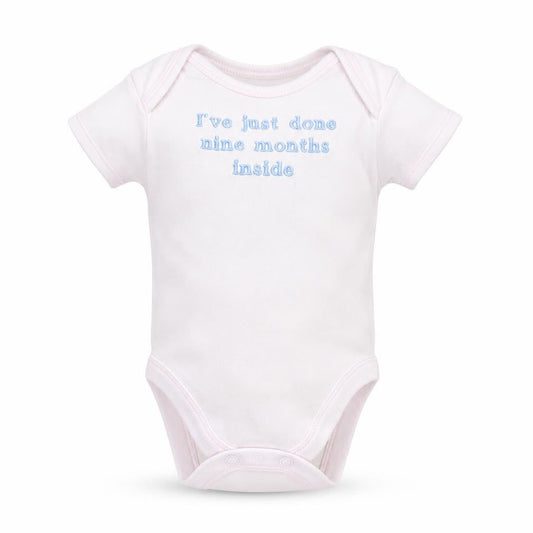 Front view of George girls’ white babygrow one-piece, size 0-3, months