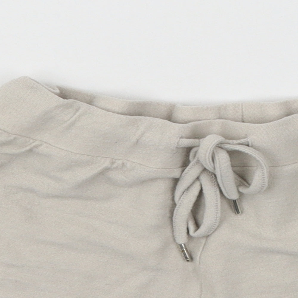 Close-up detail of Disney women’s beige solid jersey top pyjama pants, size UK 6, - mickey mouse