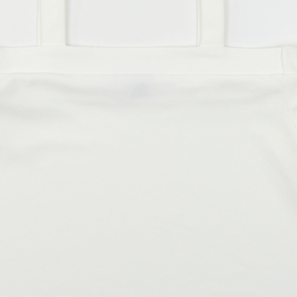 Brand and care label for Primark girls’ white jersey basic blouse, size 10-11, years