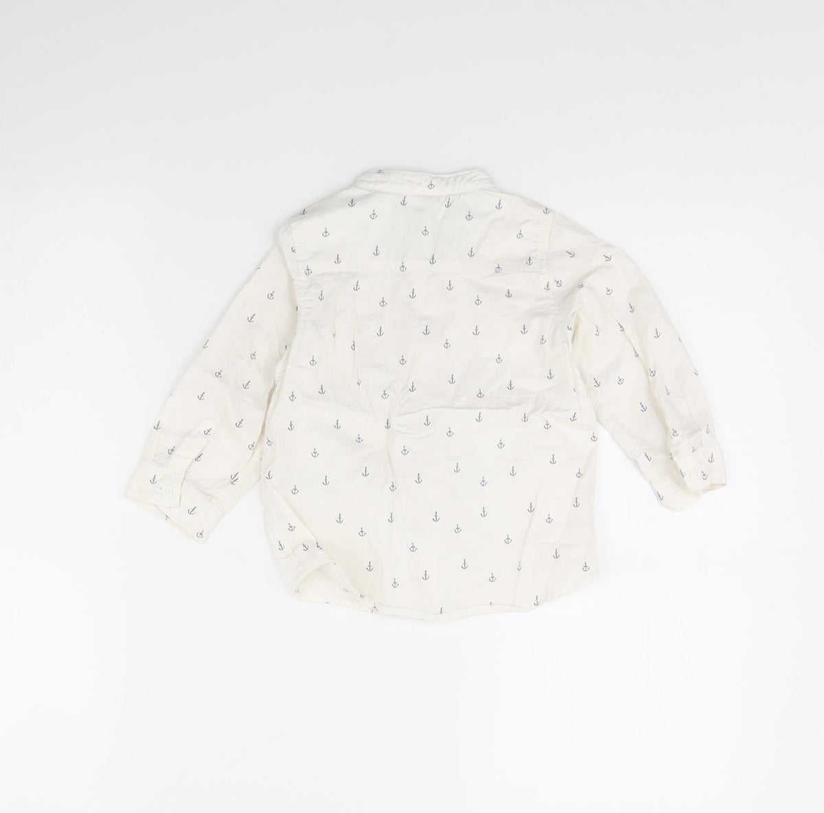 Back view of H&M girls’ white spotted basic button-up, size 12, months