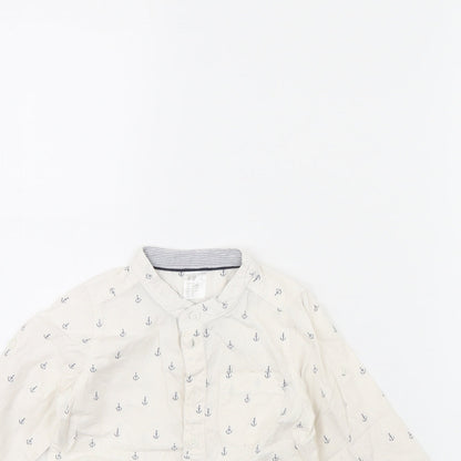 Close-up detail of H&M girls’ white spotted basic button-up, size 12, months