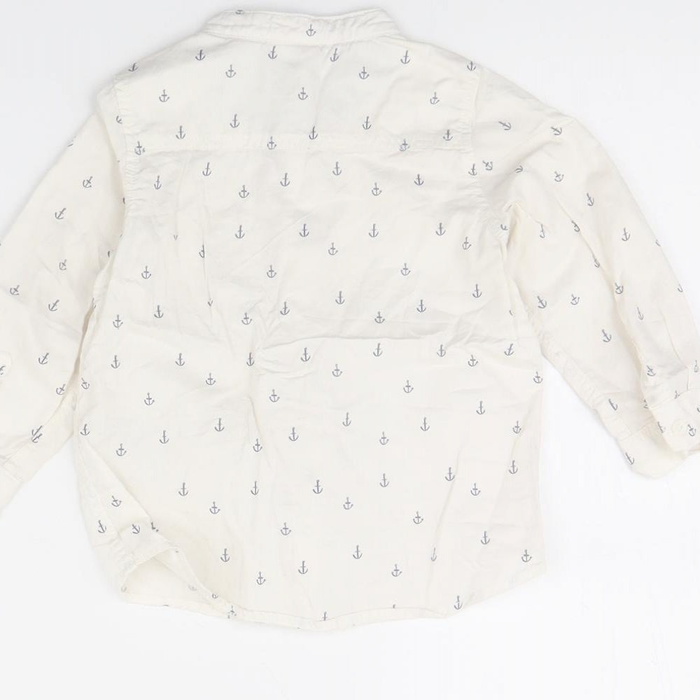 Brand and care label for H&M girls’ white spotted basic button-up, size 12, months