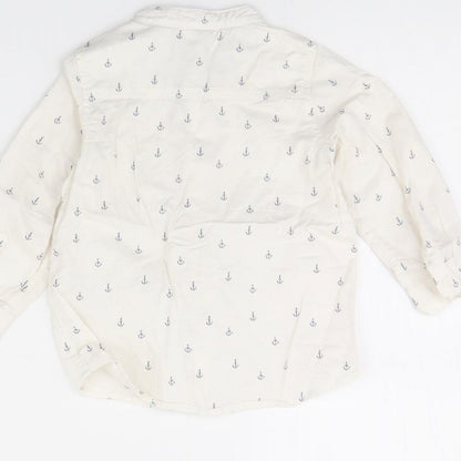 Brand and care label for H&M girls’ white spotted basic button-up, size 12, months