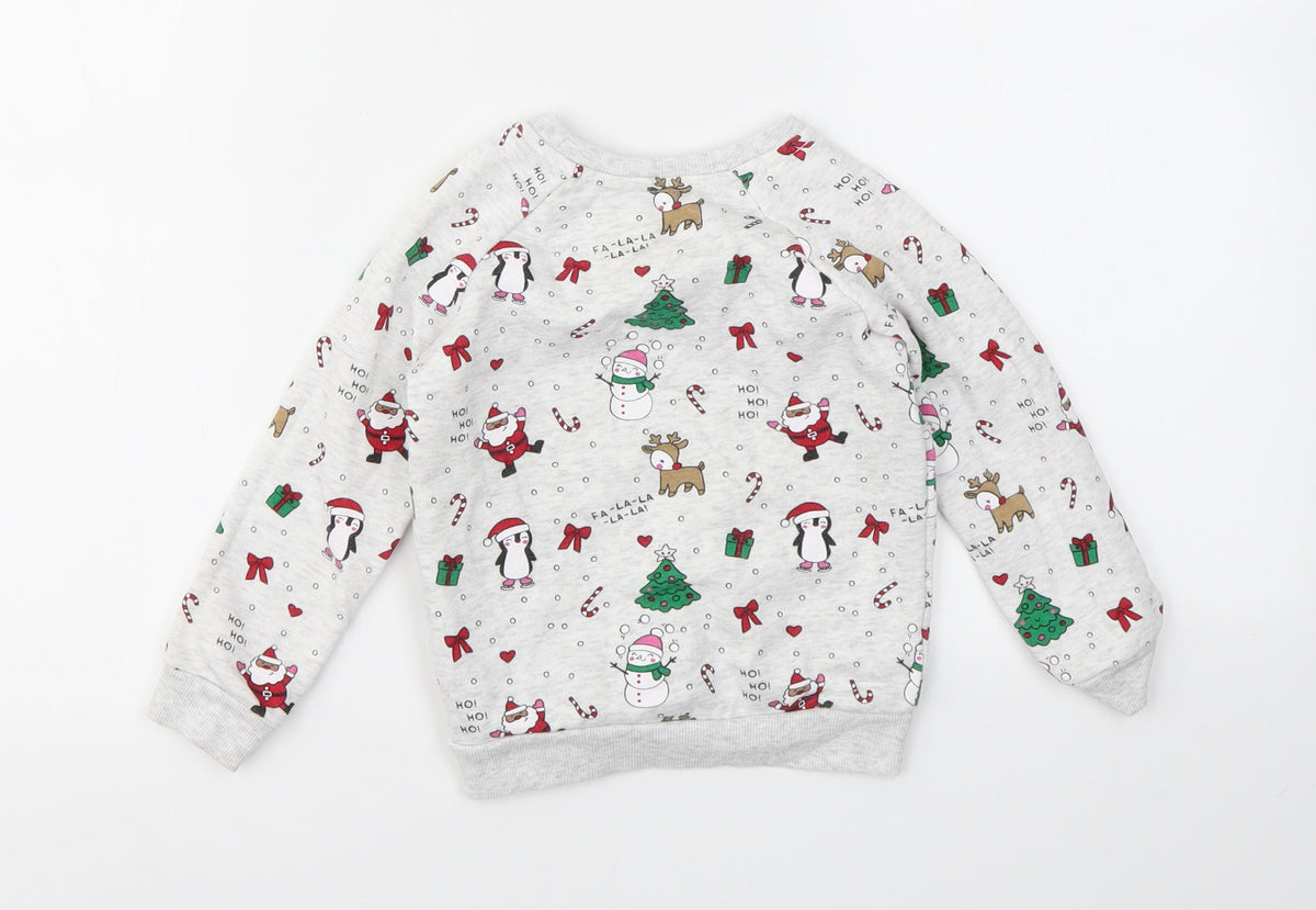 Back view of Primark girls’ multicoloured geometric jumper, size 24, months