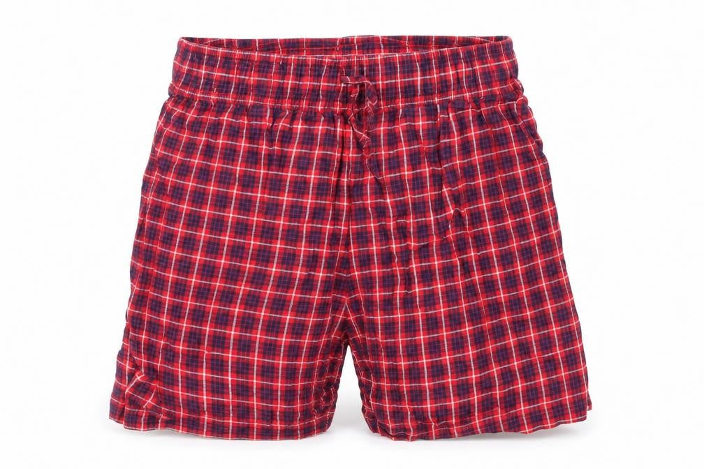 Front view of Tu girls’ red check cut-off shorts, size XS