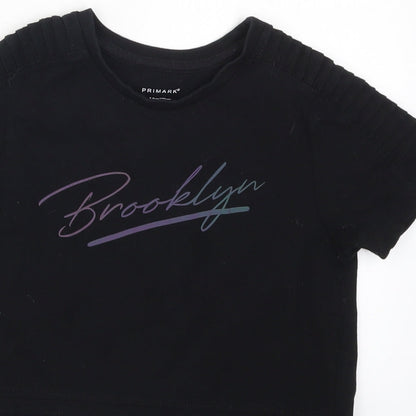 Close-up detail of Primark boys’ black basic t-shirt, size 7-8, years - brooklyn