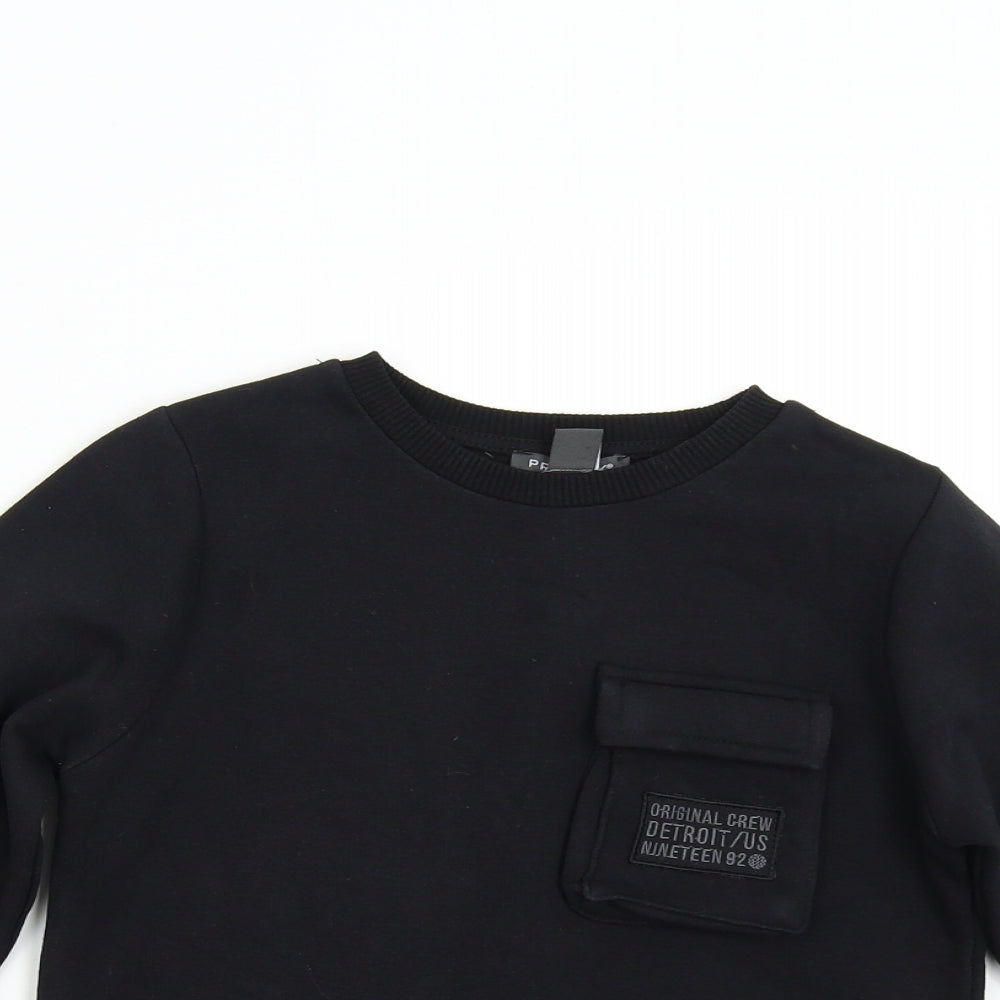Close-up detail of Primark boys’ black pullover sweatshirt, size 9-10, years