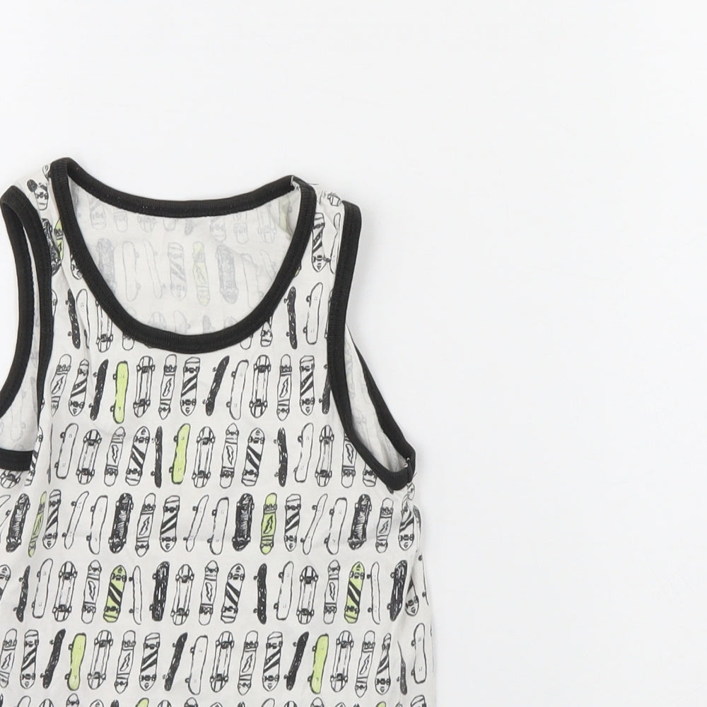 Close-up detail of Primark boys’ white spotted basic tank, size 5, years - skateboard