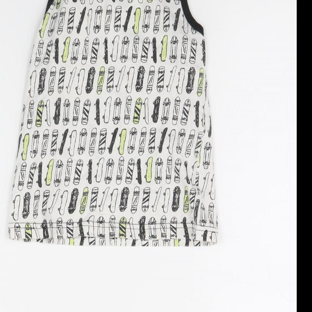 Brand and care label for Primark boys’ white spotted basic tank, size 5, years - skateboard