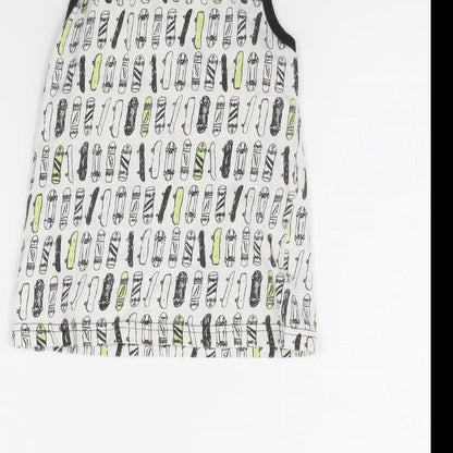Brand and care label for Primark boys’ white spotted basic tank, size 5, years - skateboard