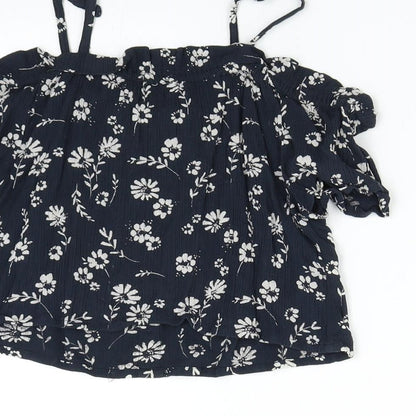 Brand and care label for Next girls’ blue floral basic blouse, size 8, years