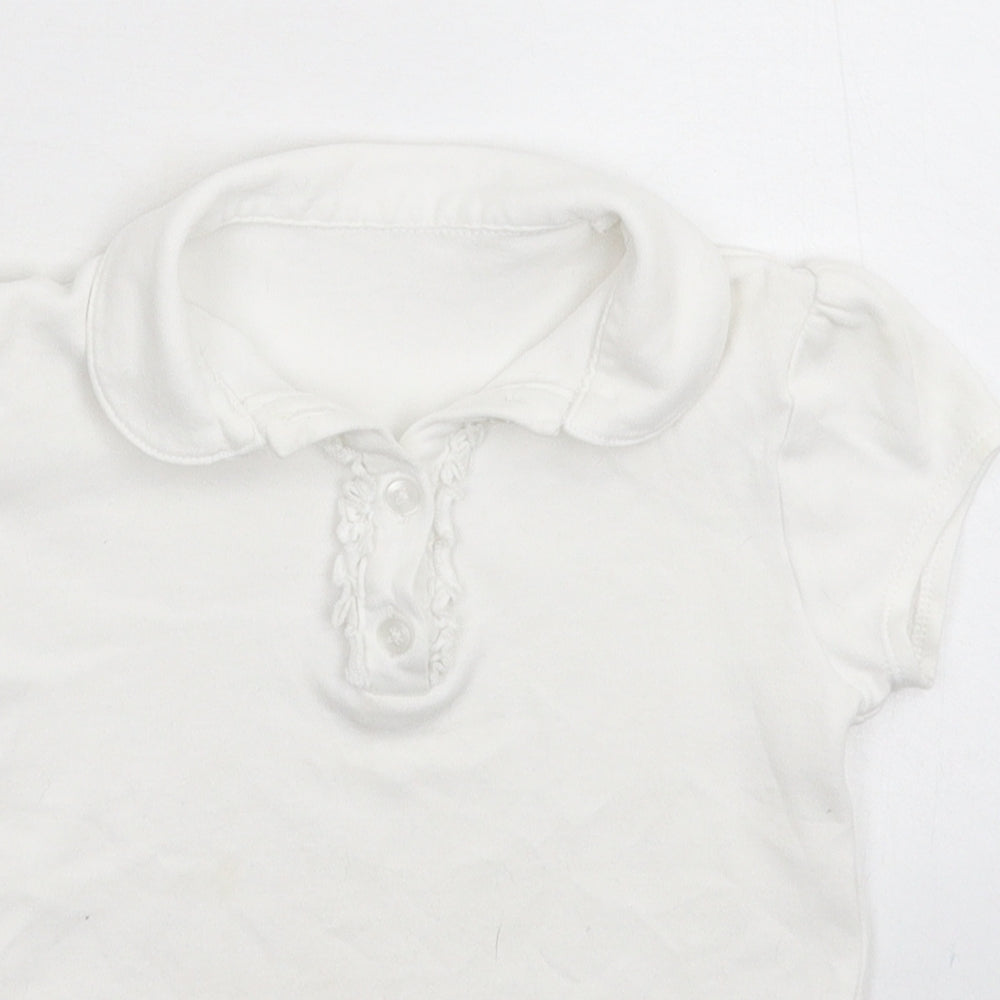 Close-up detail of George boys’ white basic polo, size 6-7, years