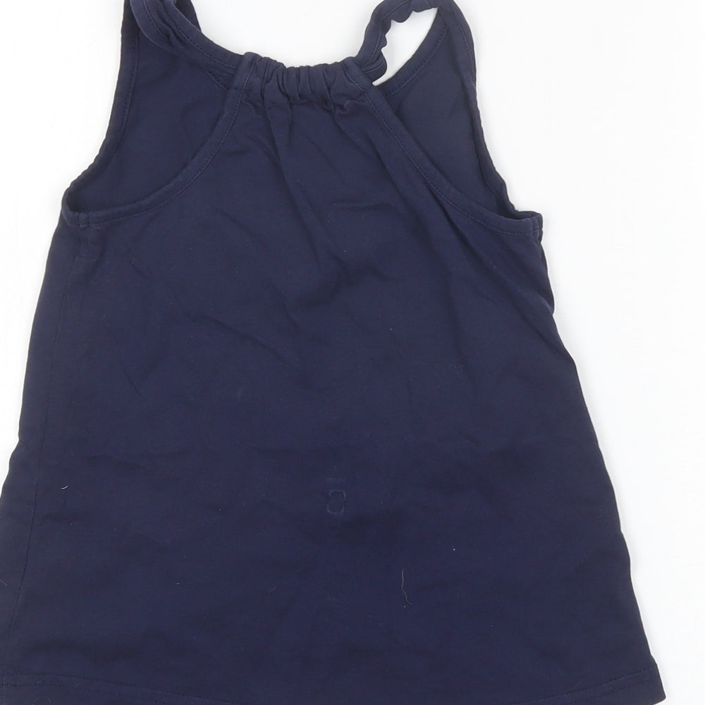 Brand and care label for Nutmeg girls’ blue basic tank, size 7-8, years