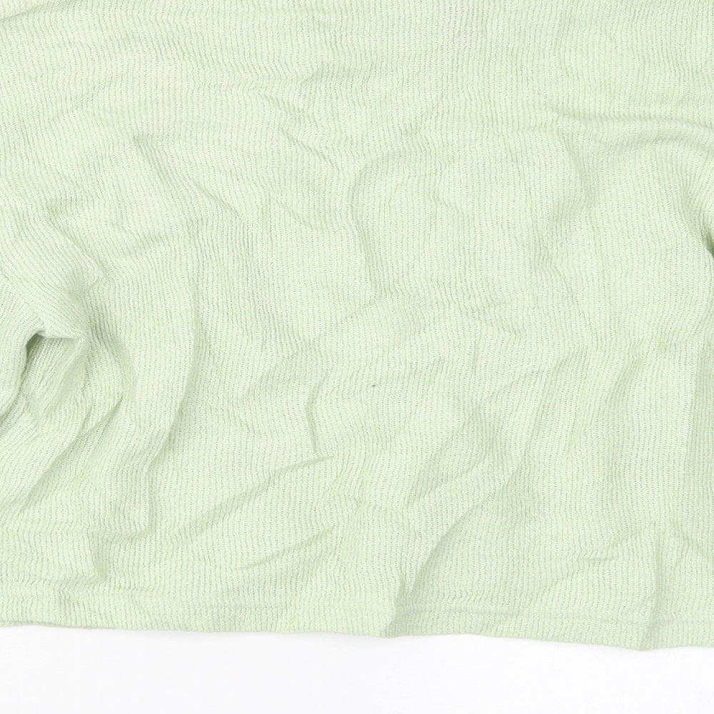 Brand and care label for Divided by H&M women’s green jumper, size XS