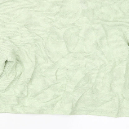 Brand and care label for Divided by H&M women’s green jumper, size XS