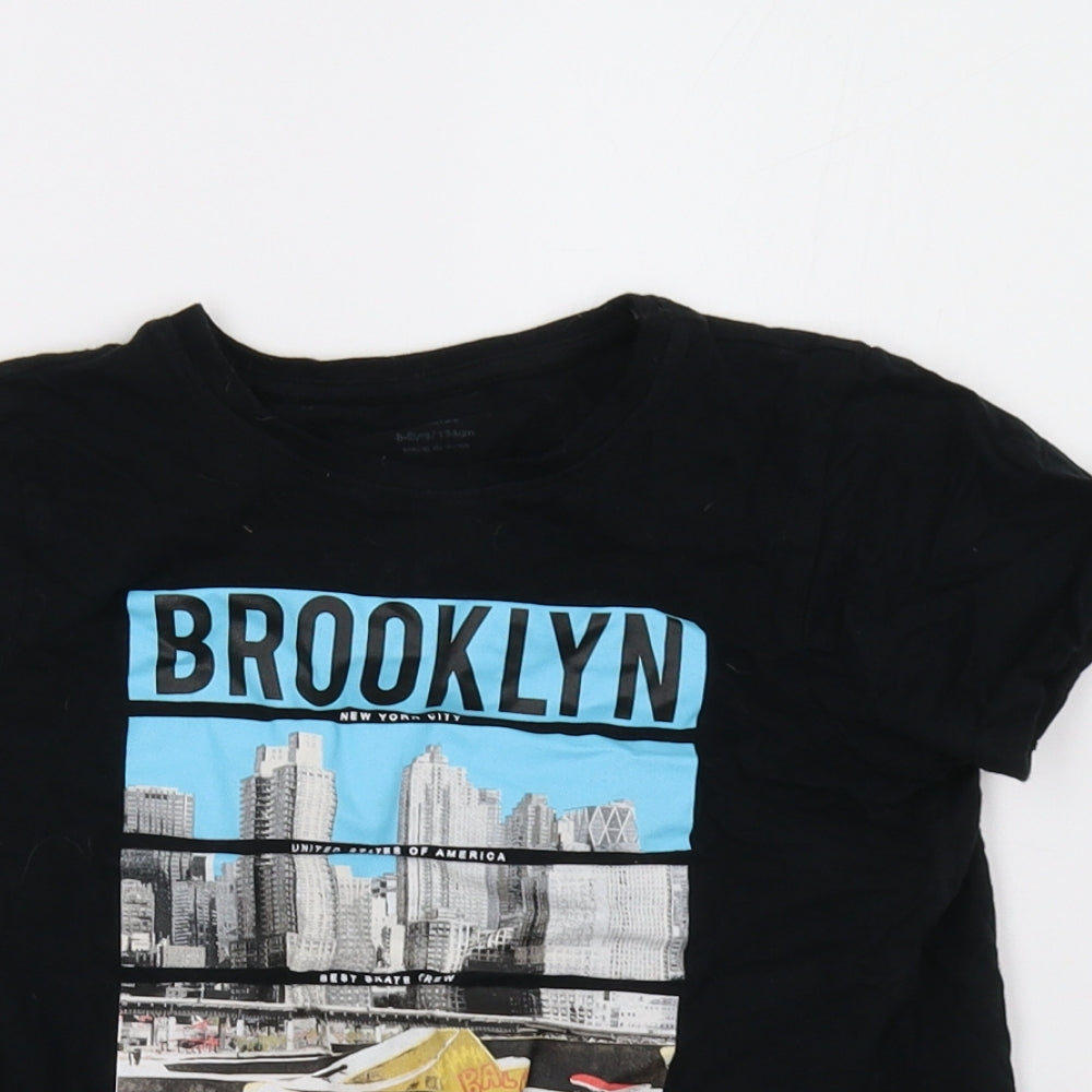 Close-up detail of Primark boys’ black basic t-shirt, size 8-9, years