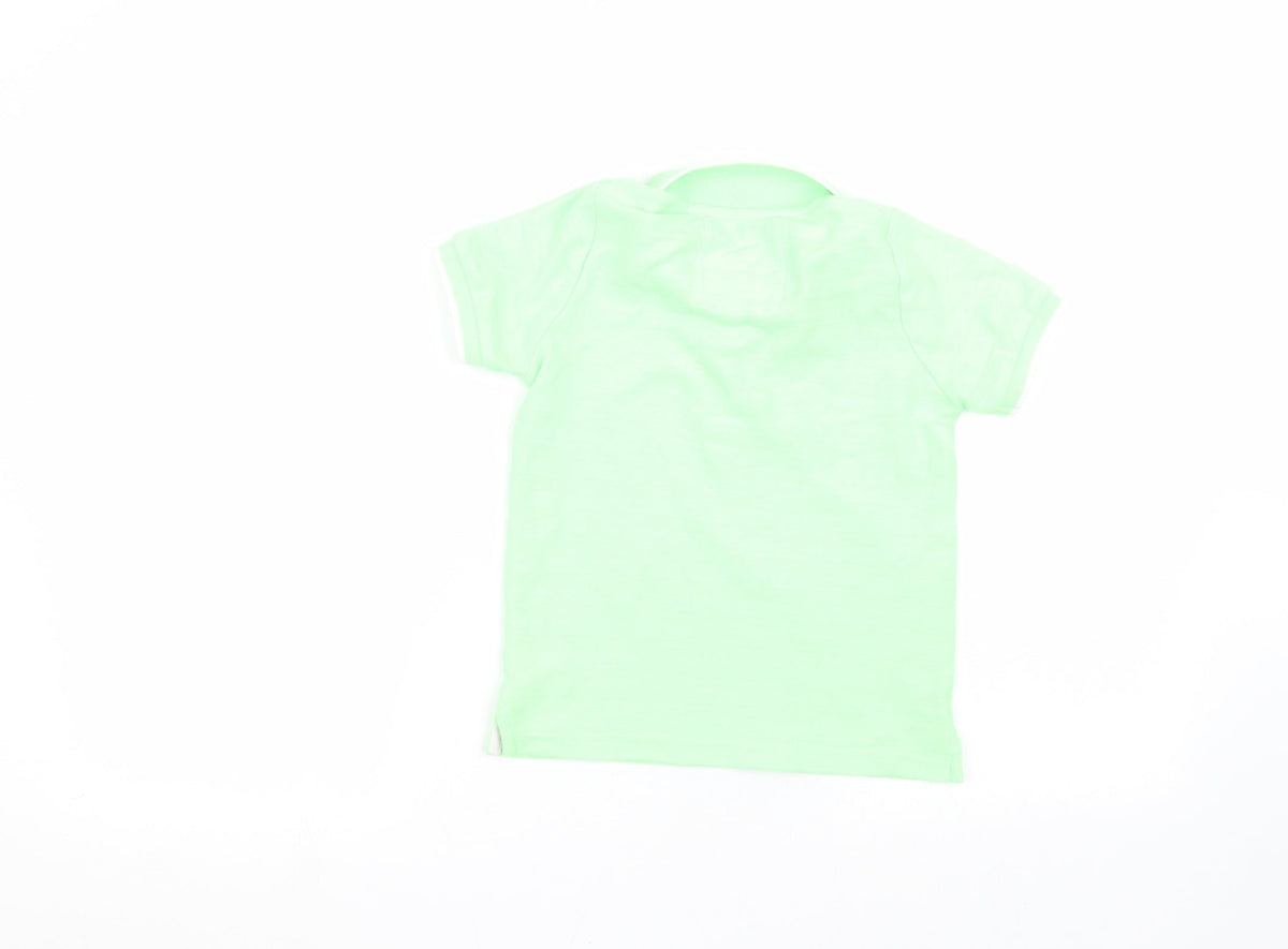 Back view of Tu boys’ green basic polo, size 5, years
