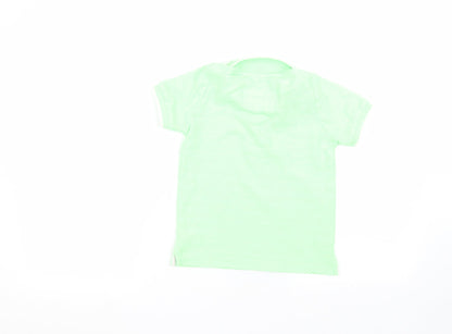 Back view of Tu boys’ green basic polo, size 5, years