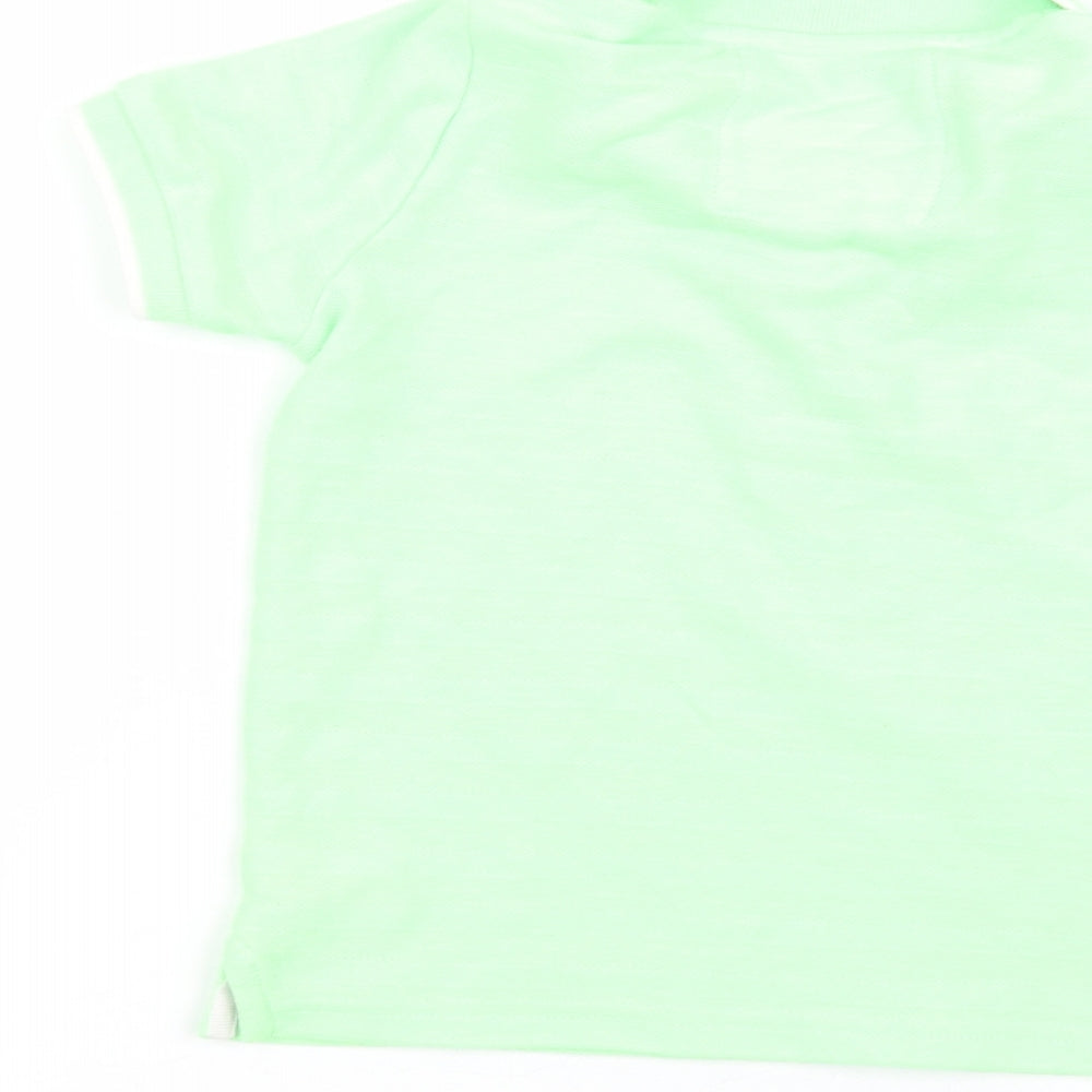 Brand and care label for Tu boys’ green basic polo, size 5, years