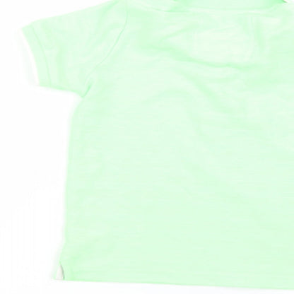 Brand and care label for Tu boys’ green basic polo, size 5, years