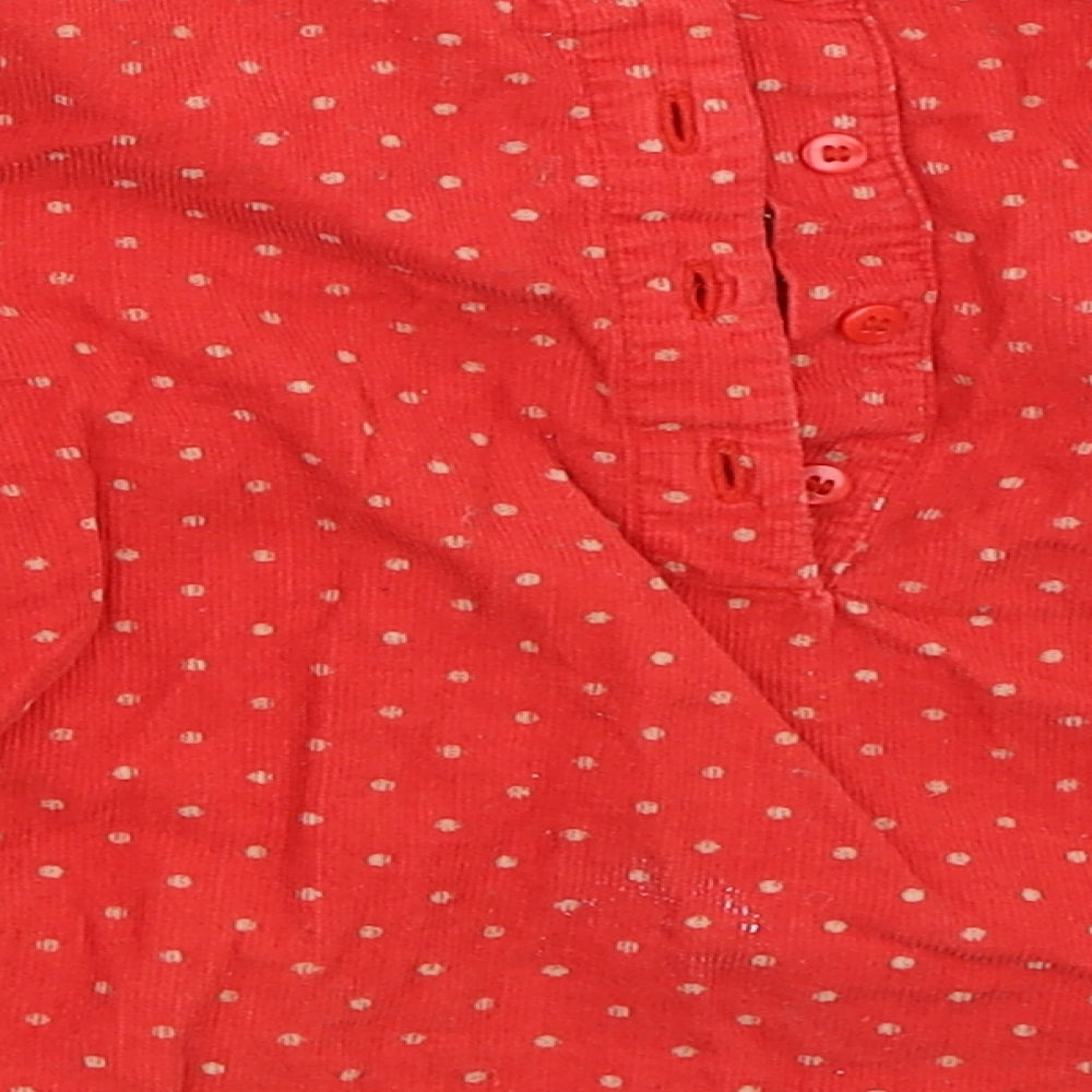Brand and care label for Mini Club girls’ red polka dot basic blouse, size 3-4, years