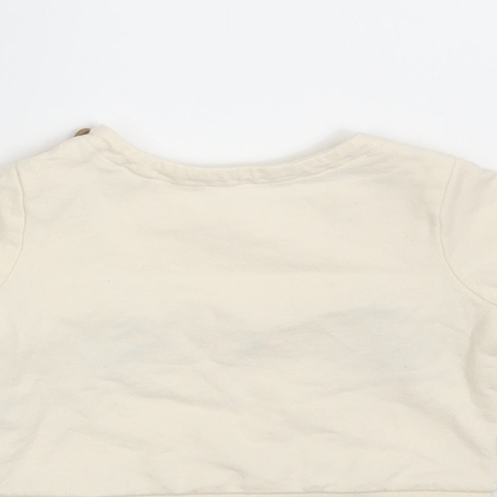 Brand and care label for Tu girls’ ivory basic t-shirt size newborn