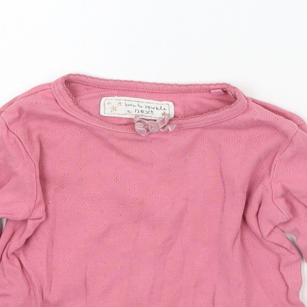 Close-up detail of Next girls’ pink basic t-shirt, size 12, months