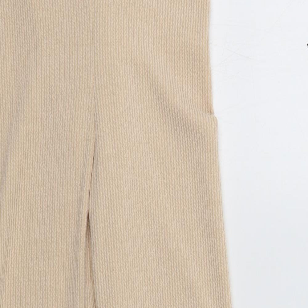 Close-up detail of PRETTYLITTLETHING women’s beige lounge pants, size UK 10