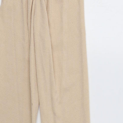 Brand and care label for PRETTYLITTLETHING women’s beige lounge pants, size UK 10