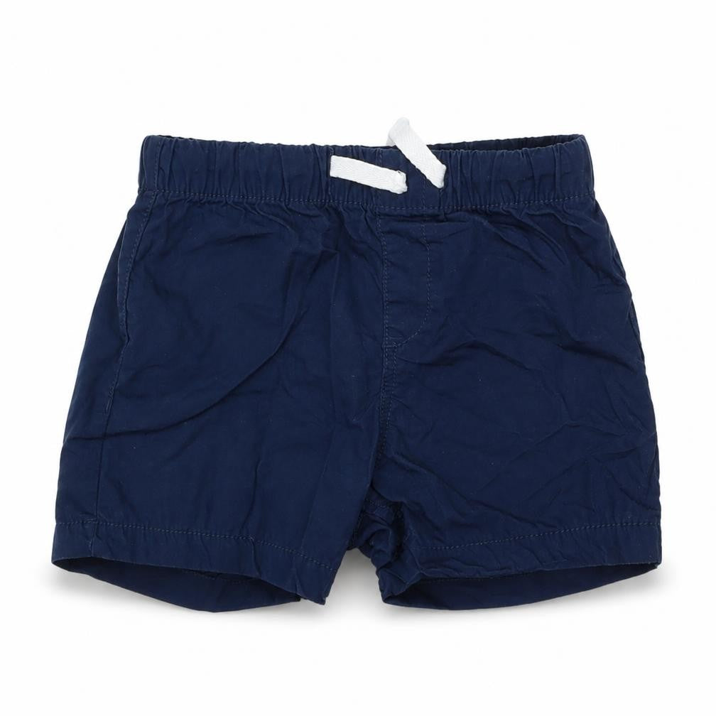 Front view of H&M boys’ blue cropped trousers, size 18-24, months