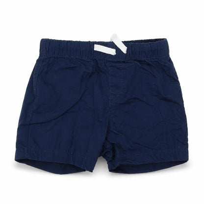 Front view of H&M boys’ blue cropped trousers, size 18-24, months