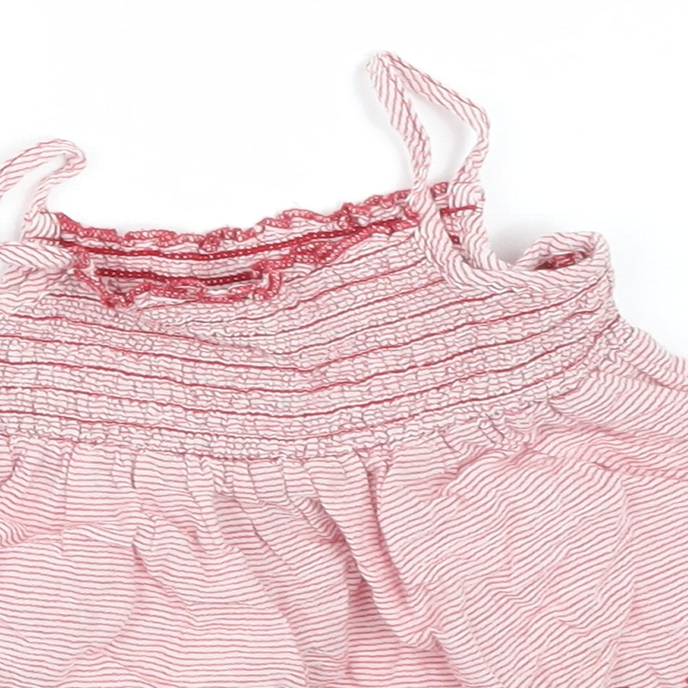Close-up detail of Primark girls’ red striped basic t-shirt, size 9-12, months