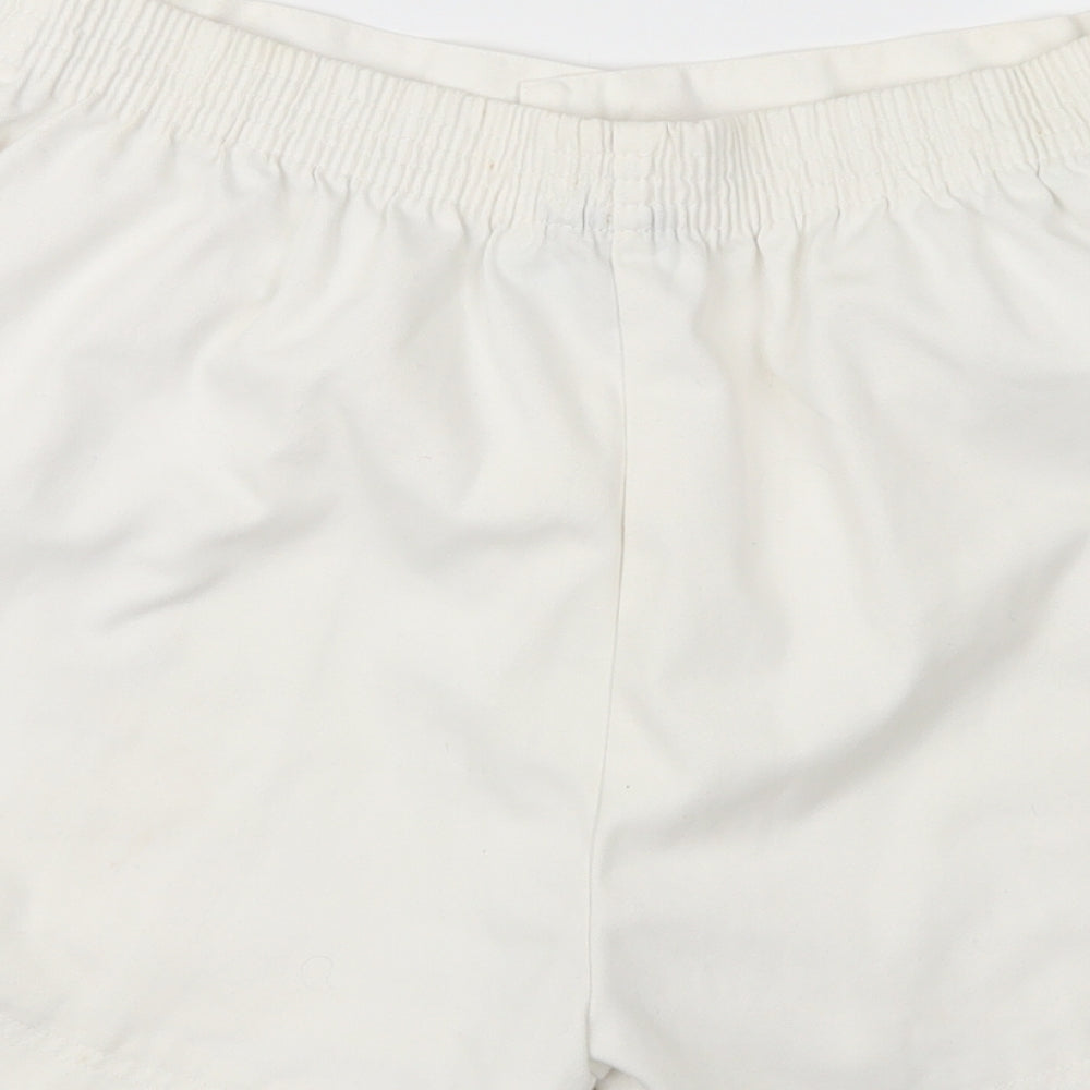 Brand and care label for Olympus women’s white cargo shorts, size XL
