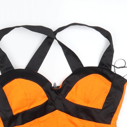 Close-up detail of Ikon women’s orange cropped tank, size UK 10